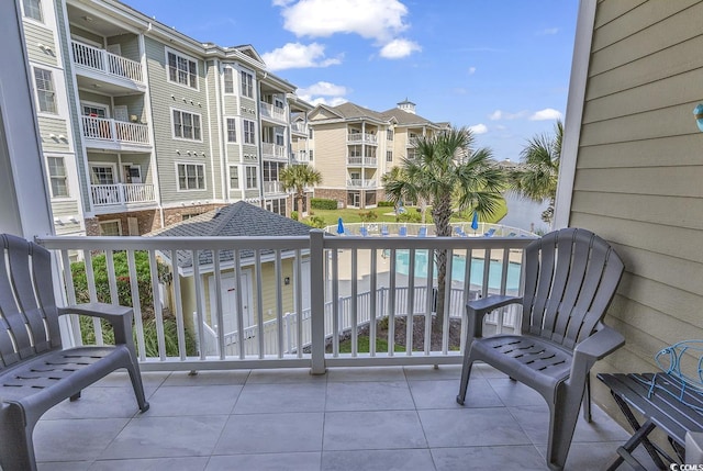 4821 Luster Leaf Cir Unit 202, Myrtle Beach, SC 29577 - balcony with view of pool and a residential view