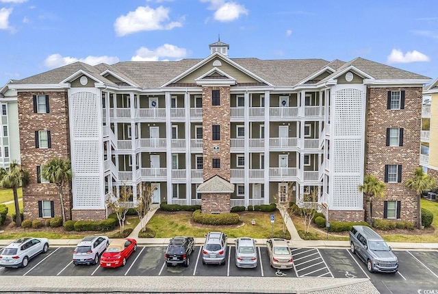 4821 Luster Leaf Cir Unit 202, Myrtle Beach, SC 29577 - view of property featuring uncovered parking