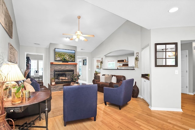 174 Edward Ave, Murrells Inlet, SC 29576 - living room featuring a stone fireplace, ceiling fan, light wood finished floors, high vaulted ceiling, and recessed lighting