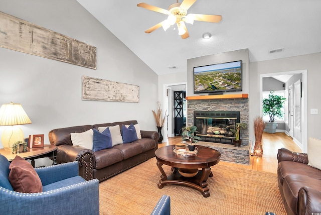 174 Edward Ave, Murrells Inlet, SC 29576 - living area with ceiling fan, wood finished floors, a stone fireplace, and vaulted ceiling