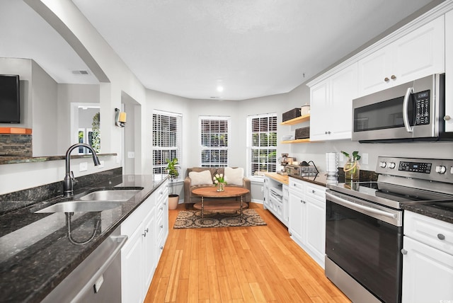 174 Edward Ave, Murrells Inlet, SC 29576 - kitchen with stainless steel appliances, white cabinetry, light wood-style floors, and recessed lighting