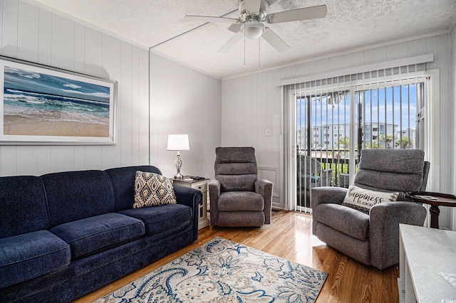9501 Shore Dr Unit 135, Myrtle Beach, SC 29572 - living area with wood finished floors, ceiling fan, a textured ceiling, and ornamental molding
