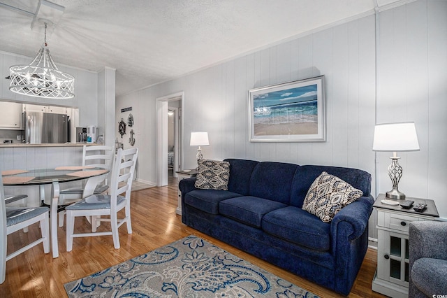 9501 Shore Dr Unit 135, Myrtle Beach, SC 29572 - living area with light wood-style floors, ornamental molding, and a textured ceiling