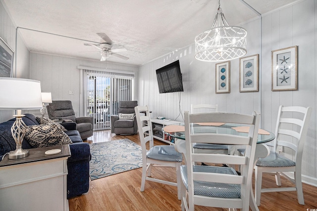 9501 Shore Dr Unit 135, Myrtle Beach, SC 29572 - living area with wood finished floors, a ceiling fan, and a textured ceiling