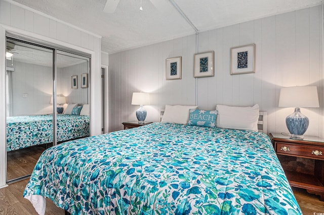 9501 Shore Dr Unit 135, Myrtle Beach, SC 29572 - bedroom with wood finished floors, ceiling fan, and a closet
