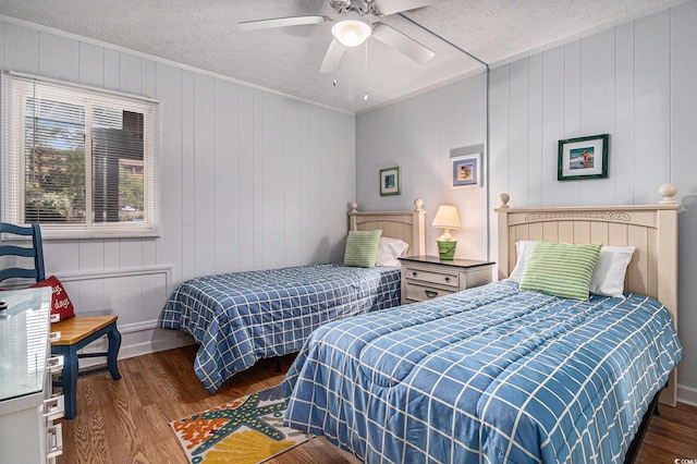 9501 Shore Dr Unit 135, Myrtle Beach, SC 29572 - bedroom with wood finished floors, crown molding, a textured ceiling, and a ceiling fan