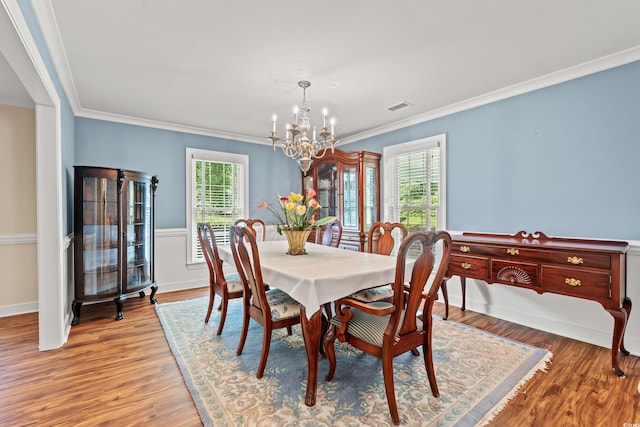 1032 Chelsey Cir, Conway, SC 29526 - dining room with a chandelier, crown molding, and wood finished floors