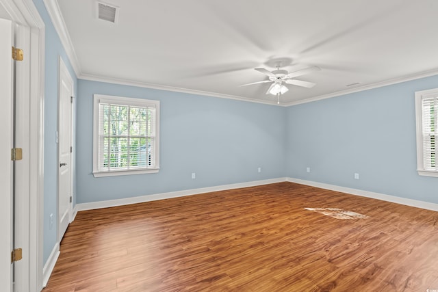 1032 Chelsey Cir, Conway, SC 29526 - empty room featuring plenty of natural light, a ceiling fan, wood finished floors, and ornamental molding