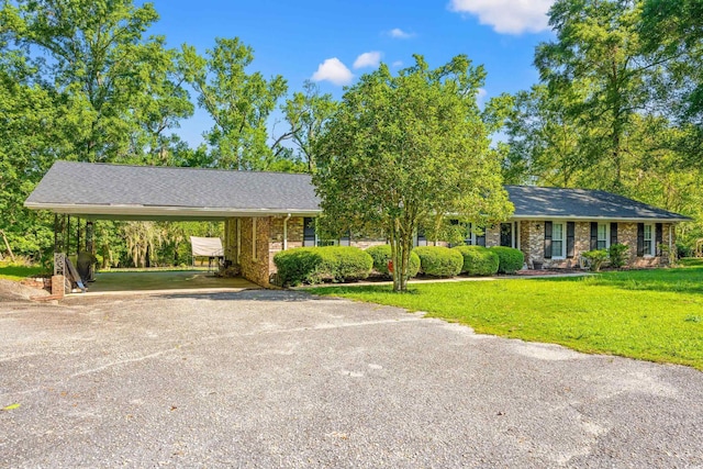 1032 Chelsey Cir, Conway, SC 29526 - single story home featuring driveway, a front yard, brick siding, an attached carport, and roof with shingles