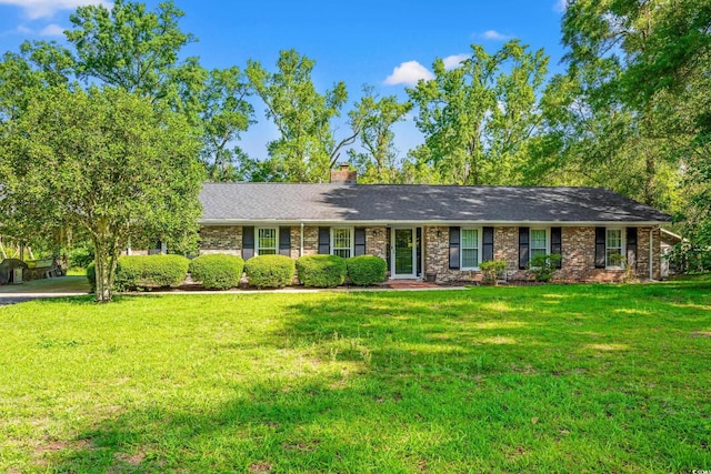 1032 Chelsey Cir, Conway, SC 29526 - ranch-style home featuring a front yard, a chimney, brick siding, and roof with shingles