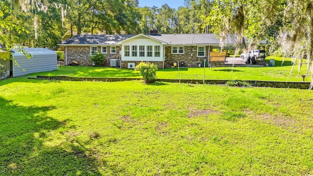 1032 Chelsey Cir, Conway, SC 29526 - rear view of house with a shed, a lawn, a chimney, brick siding, and view of scattered trees