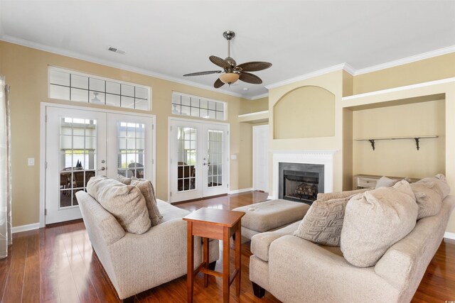 2210 Haystack Way, Myrtle Beach, SC 29579 - living area with french doors, a ceiling fan, ornamental molding, dark wood finished floors, and a fireplace
