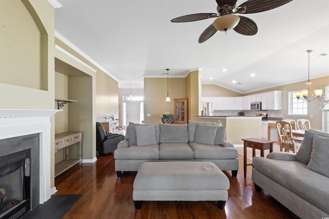 2210 Haystack Way, Myrtle Beach, SC 29579 - living room featuring crown molding, dark wood-style floors, a fireplace with flush hearth, a ceiling fan, and a chandelier