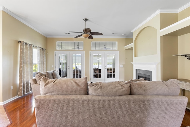 2210 Haystack Way, Myrtle Beach, SC 29579 - living room with french doors, ceiling fan, ornamental molding, a fireplace, and dark wood-style flooring