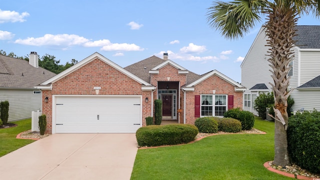 2210 Haystack Way, Myrtle Beach, SC 29579 - view of front of home featuring brick siding, concrete driveway, an attached garage, a front lawn, and a chimney