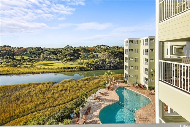 9400 Shore Dr Unit 409, Myrtle Beach, SC 29572 - view of swimming pool featuring a water view and a patio area