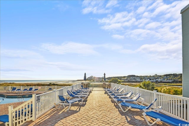 9400 Shore Dr Unit 409, Myrtle Beach, SC 29572 - view of patio featuring a water view and a community pool