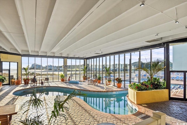 9400 Shore Dr Unit 409, Myrtle Beach, SC 29572 - indoor community pool with a patio and a mountain view