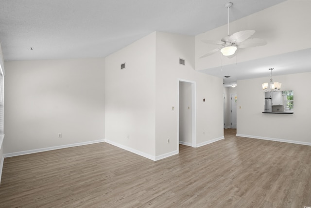 6576 Pebble Beach Cres, Myrtle Beach, SC 29588 - unfurnished living room with a chandelier, wood finished floors, a ceiling fan, and high vaulted ceiling