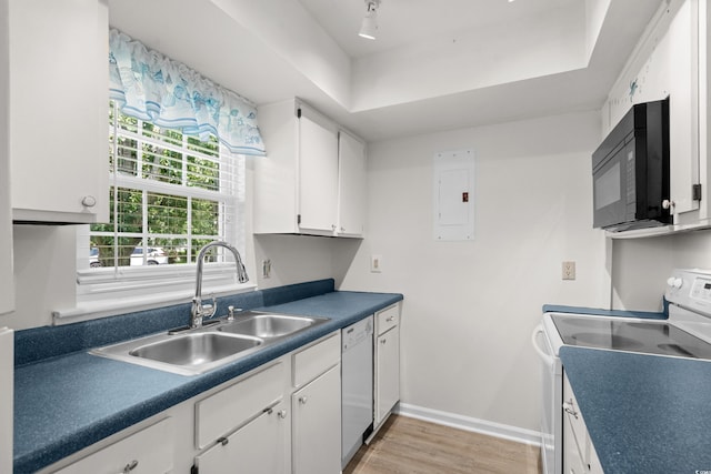 6576 Pebble Beach Cres, Myrtle Beach, SC 29588 - kitchen with white appliances, electric panel, a tray ceiling, white cabinets, and dark countertops