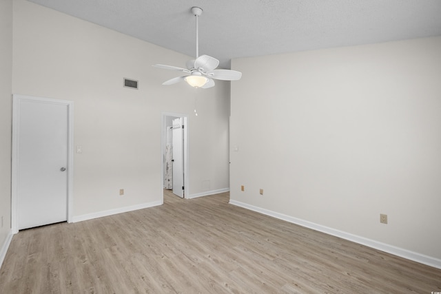 6576 Pebble Beach Cres, Myrtle Beach, SC 29588 - unfurnished room featuring a ceiling fan, light wood finished floors, and a high ceiling