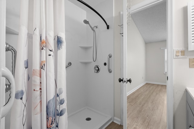 6576 Pebble Beach Cres, Myrtle Beach, SC 29588 - bathroom with a stall shower, wood finished floors, vanity, and a textured ceiling