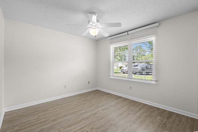 6576 Pebble Beach Cres, Myrtle Beach, SC 29588 - unfurnished room featuring a textured ceiling, wood finished floors, and a ceiling fan