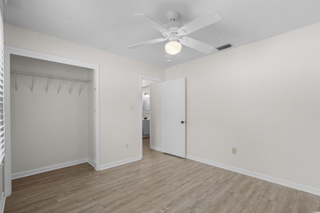 6576 Pebble Beach Cres, Myrtle Beach, SC 29588 - unfurnished bedroom featuring wood finished floors, a closet, a ceiling fan, and a textured ceiling