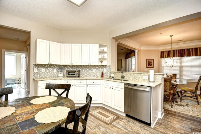 5650 Barefoot Resort Bridge Rd Unit 431, North Myrtle Beach, SC 29582 - kitchen featuring stainless steel dishwasher, tasteful backsplash, white cabinetry, light wood-style flooring, and a textured ceiling