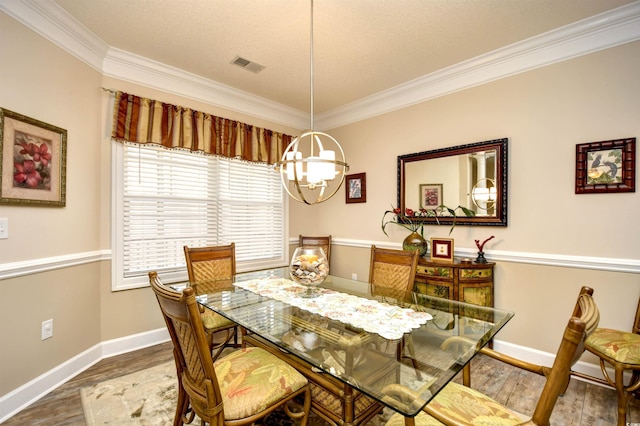 5650 Barefoot Resort Bridge Rd Unit 431, North Myrtle Beach, SC 29582 - dining space featuring a chandelier, ornamental molding, and wood finished floors