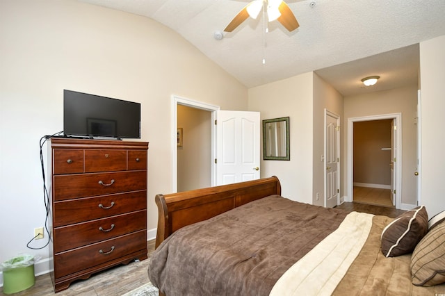 5650 Barefoot Resort Bridge Rd Unit 431, North Myrtle Beach, SC 29582 - bedroom with lofted ceiling, ensuite bath, ceiling fan, and wood finished floors