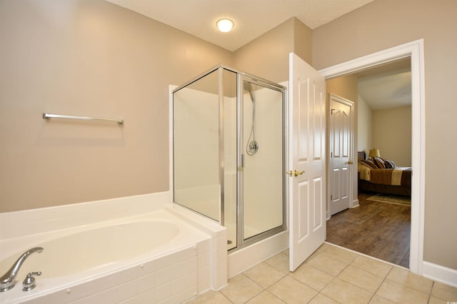 5650 Barefoot Resort Bridge Rd Unit 431, North Myrtle Beach, SC 29582 - ensuite bathroom featuring a garden tub, tile patterned floors, and a stall shower