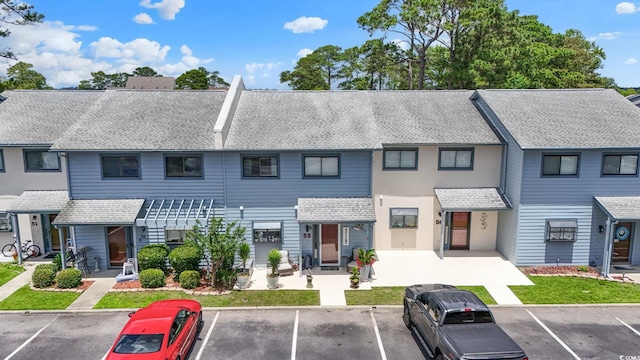 775 Plantation Dr Unit 53, Little River, SC 29566 - view of front of home with a shingled roof and uncovered parking