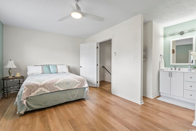 775 Plantation Dr Unit 53, Little River, SC 29566 - bedroom featuring light wood-style flooring, a ceiling fan, and ensuite bath