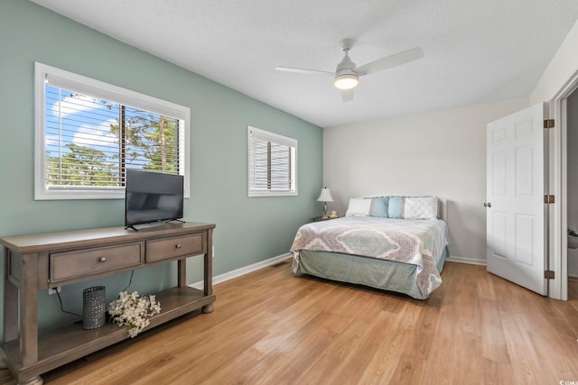 775 Plantation Dr Unit 53, Little River, SC 29566 - bedroom with light wood finished floors and ceiling fan
