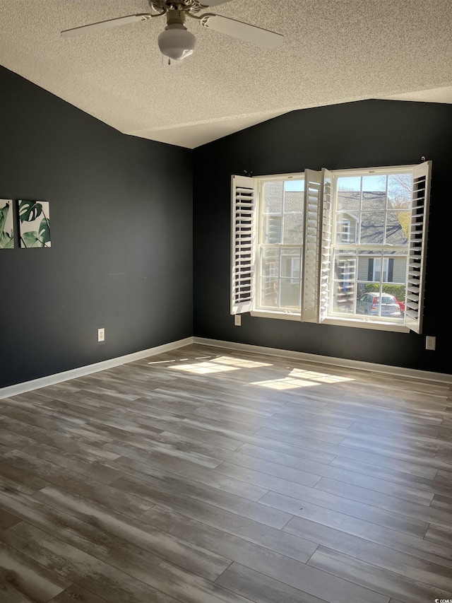 4840 Moss Creek Loop Unit 31, Murrells Inlet, SC 29576 - empty room with a textured ceiling, a ceiling fan, lofted ceiling, and wood finished floors