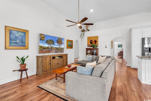 5 Tiara Ln, Murrells Inlet, SC 29576 - living room with arched walkways, light wood-style flooring, ceiling fan, lofted ceiling, and recessed lighting
