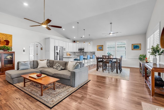 5 Tiara Ln, Murrells Inlet, SC 29576 - living room featuring ceiling fan, vaulted ceiling, arched walkways, light wood-style flooring, and recessed lighting