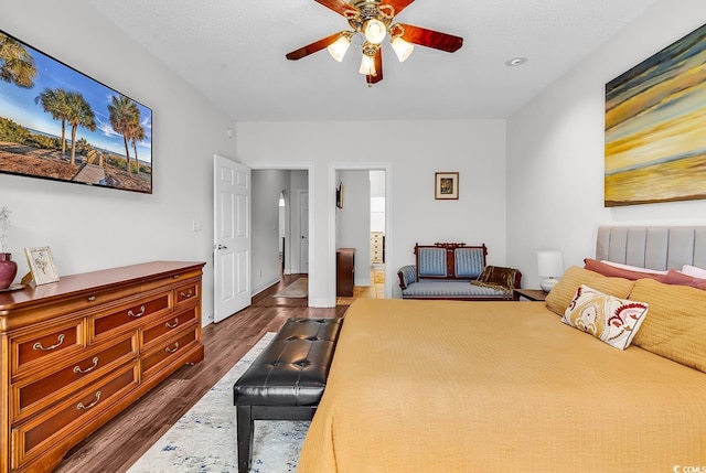 5 Tiara Ln, Murrells Inlet, SC 29576 - bedroom with dark wood-style floors, connected bathroom, and ceiling fan