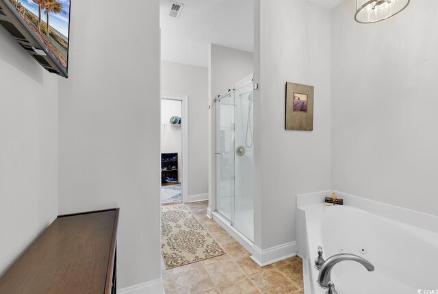 5 Tiara Ln, Murrells Inlet, SC 29576 - bathroom with a shower stall, a jetted tub, and tile patterned floors