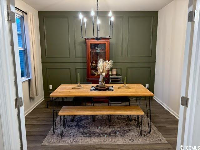651 Choctaw Dr, Conway, SC 29526 - dining area with dark wood-type flooring and a chandelier