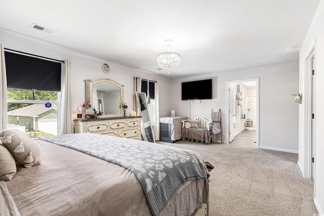 651 Choctaw Dr, Conway, SC 29526 - bedroom with a chandelier, light colored carpet, and connected bathroom
