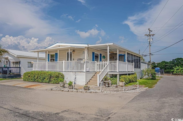 6001-1459 S Kings Hwy, Myrtle Beach, SC 29575 - manufactured / mobile home with covered porch and stairway