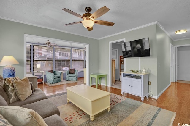 6001-1459 S Kings Hwy, Myrtle Beach, SC 29575 - living room featuring ornamental molding, wood finished floors, ceiling fan, and a textured ceiling