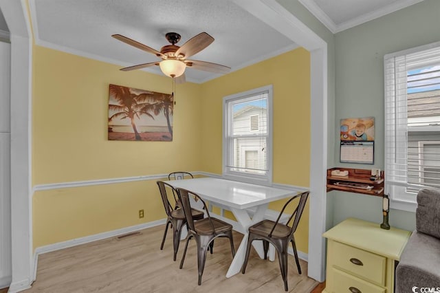 6001-1459 S Kings Hwy, Myrtle Beach, SC 29575 - dining space with healthy amount of natural light, crown molding, light wood-style floors, and a ceiling fan