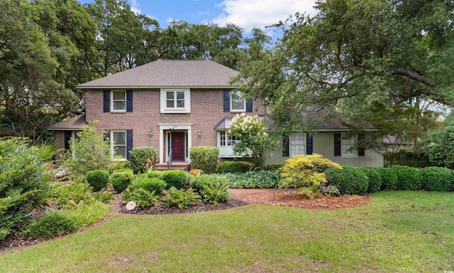 571 Fernwood Rd, Murrells Inlet, SC 29576 - colonial inspired home with a front lawn and brick siding
