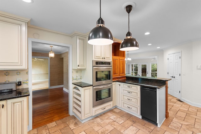 571 Fernwood Rd, Murrells Inlet, SC 29576 - kitchen with stainless steel double oven, crown molding, recessed lighting, french doors, and cream cabinets