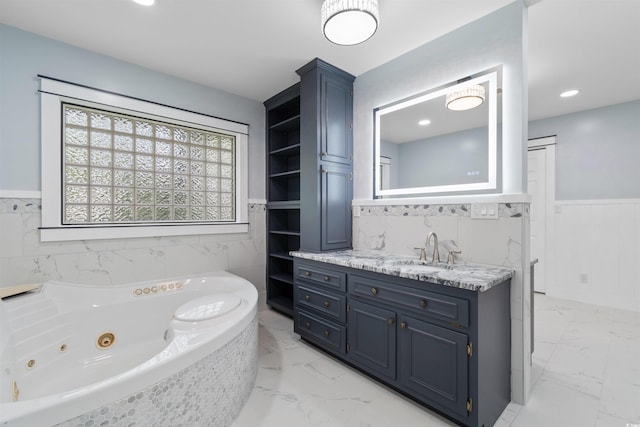 571 Fernwood Rd, Murrells Inlet, SC 29576 - full bathroom with marble finish flooring, a tub with jets, wainscoting, and vanity