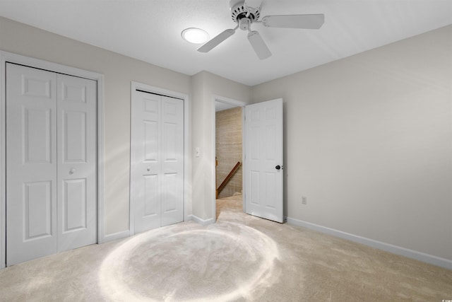 571 Fernwood Rd, Murrells Inlet, SC 29576 - unfurnished bedroom with carpet floors, a ceiling fan, and two closets