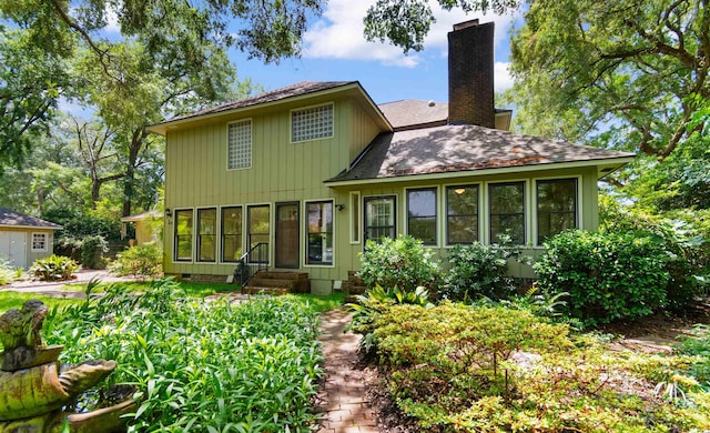 571 Fernwood Rd, Murrells Inlet, SC 29576 - back of property with a chimney, entry steps, a shingled roof, and crawl space